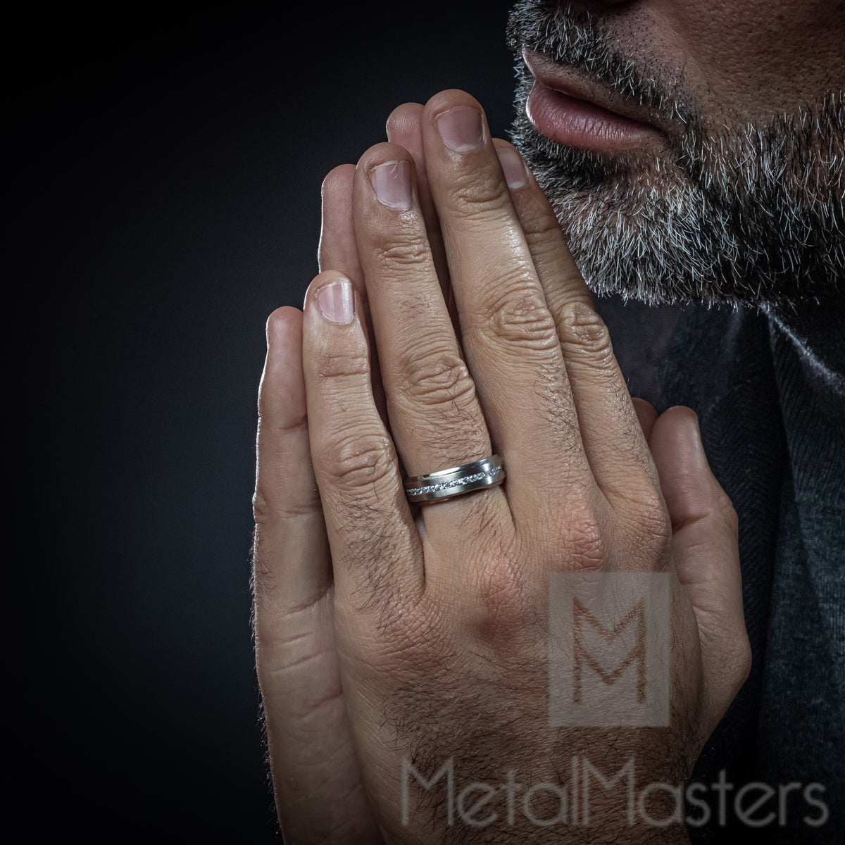Men's Black Polished Titanium Wedding Band With CZ Diamond Inlaid Throughout The Men's Black Polished Titanium Wedding Band With CZ Diamond Inlaid Throughout The